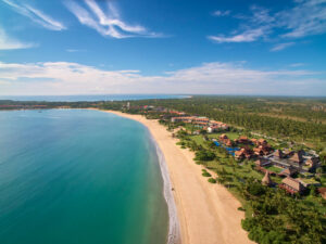 Aerial,View,Of,Hotels,Set,In,Trees,Adjoining,A,Tropical